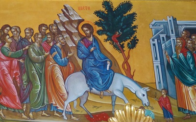 Jesus reitet auf einem Esel nach Jerusalem ein