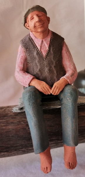 Sitzender Mann in Holz Sitzender Mann in Holz